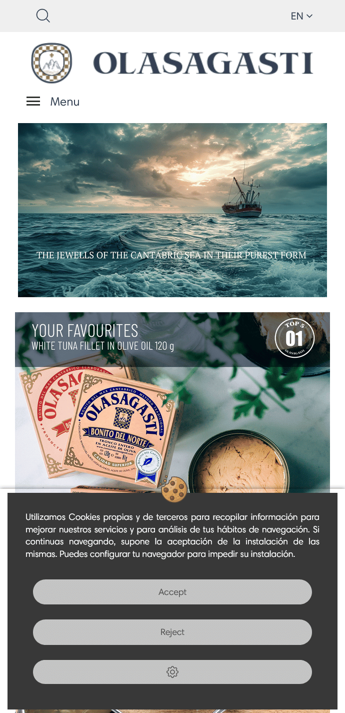 Sección de inicio (home) en ingles de la versión móvil de la página web de Conservas Olasagasti, con imagen de un barco en el mar Cantábrico y productos destacados de la marca